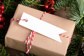 Christmas rectangle strip gift tag mockup with present box, product label mockup, with natural fir...