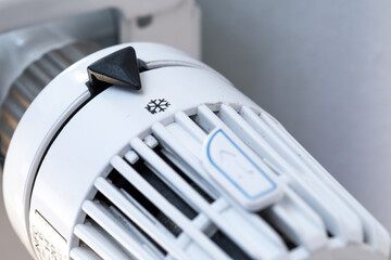 Detail shot of a heater temperature control put on level anti frost to illustrate energy crisis for warm home