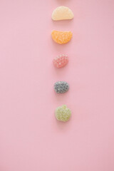 Italian jelly fruit sweets on pink background