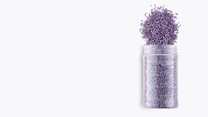 A pack of purple glitter crystal salt for aroma spa. Shimmering sea salt isolated on white background. Can of purple bath salt. The idea of home relaxation, aromatherapy and self care. Copy space