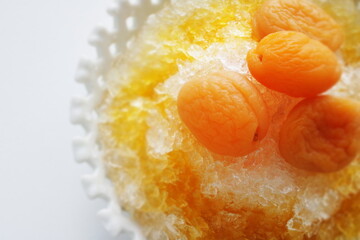 Korean street food, shaved ice Bingsu severed with dried apricot and sweet honey sauce