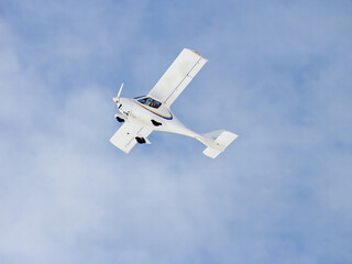 Zoom photo of small propeller airplane landing to small airport