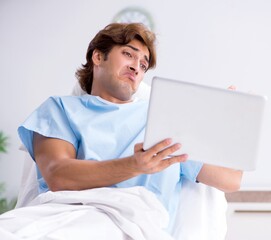 Young male patient lying on couch in hospital