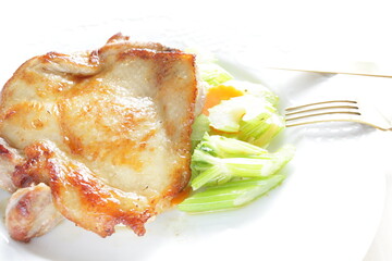 Homemade grilled chicken tight meat served with celery and carrot