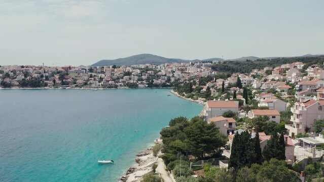 Aerial top view Croatia coast. A town on an island on the Adriatic coast with houses with red roofs, beaches and tourist places.