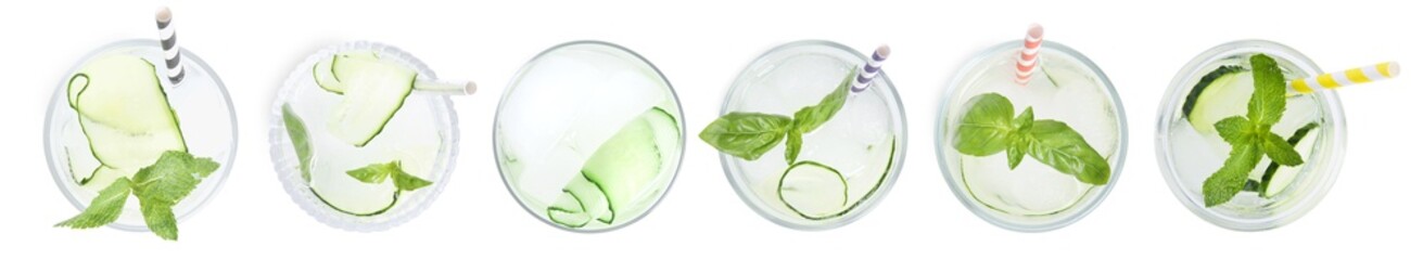 Set of glasses with refreshing cucumber water on white background, top view. Banner design