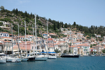 Fototapeta na wymiar Beautiful view of coastal city with sailboats on sunny day