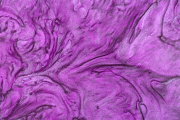 Purple glitter texture with sequins. Shining background