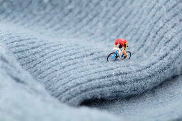 Miniature world cycling exercise on sweaters