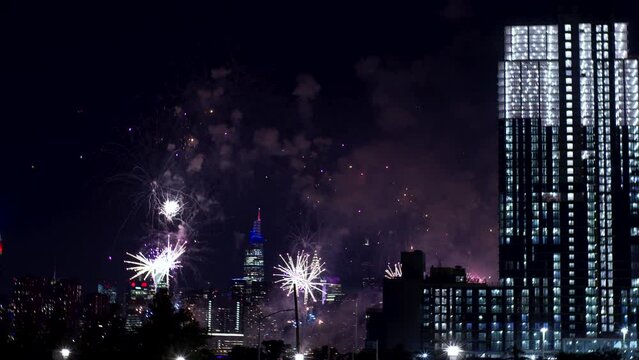 Magnificent fireworks over New York at Independence day, 4th of July. View Manhattan view from Queens borough, Empire State building is on the left 