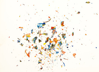 Colorful dried paint chips isolated against a white background. 