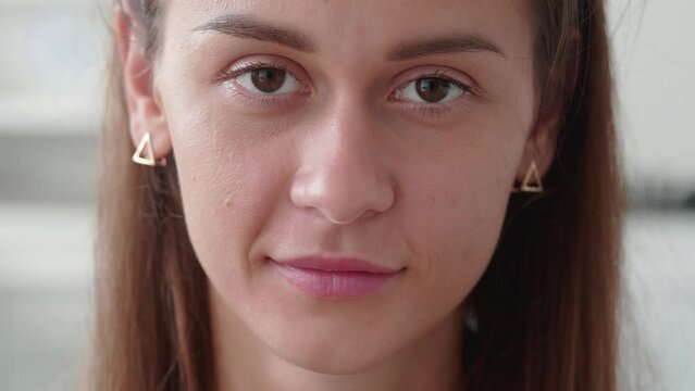 close up portrait of attractive woman smiling brunette confident pretty ooking at camera