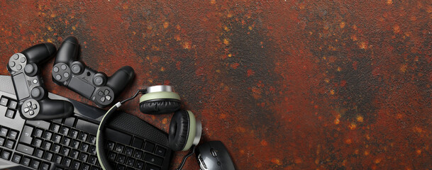 Modern gaming accessories on grunge background with space for text © Pixel-Shot