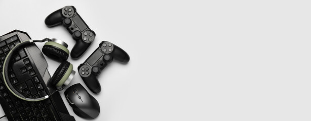 Modern gaming accessories on light background with space for text © Pixel-Shot