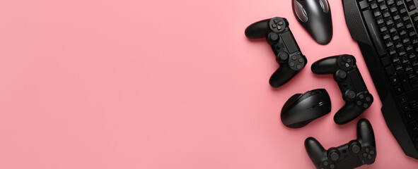 Modern gaming accessories on pink background with space for text © Pixel-Shot