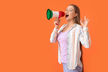 Young woman with megaphone on orange background. Concept of studying Italian language