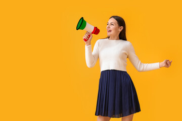 Young woman with megaphone on yellow background. Concept of studying Italian language