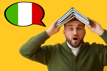 Surprised young man with books on yellow background. Studying of Italian language