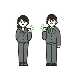 控えめにガッツポーズをするスーツの男女 green