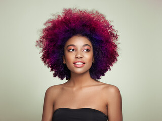 Beauty portrait of African American girl with colorful dyed afro hair. Beautiful black woman....