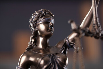 Law and justice concept. Justice symbol - Themis sculpture on gray background.