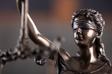 Law and justice concept. Justice symbol - Themis sculpture on gray background.