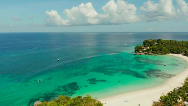 Tropical white sand beach, hotels near the blue lagoon and corall reef. aerial view, Boracay, Philippines. Seascape with beach on tropical island. Summer and travel vacation concept.