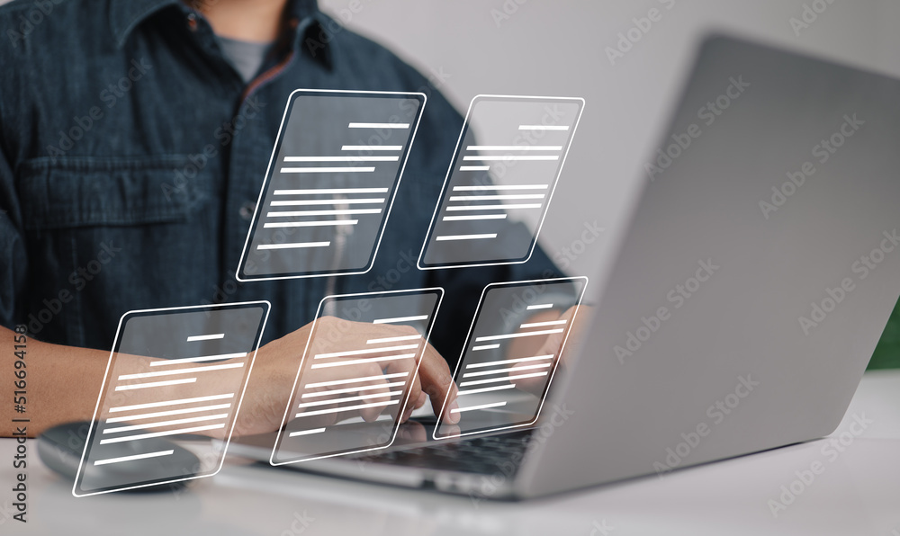 Leinwandbilder a businessman using a laptop with the idea of a paperless workplace, e-document management, online d