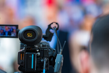 TV Camera Recording Political Rally