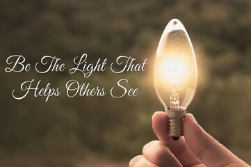 Motivational and Inspirational quote - Be the light that helps others see. With light bulb in...