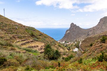 Fototapeta na wymiar Panoramic view on Roque de las Animas crag and Roque en Medio in the Anaga mountain range, north coast of Tenerife, Canary Islands, Spain, Europe. Hiking trail from Afur to Taganana. Atlantic Ocean