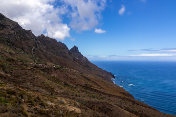 Panoramic view of Atlantic Ocean coastline and Anaga mountain range on Tenerife, Canary Islands, Spain, Europe, EU. Looking at Cabezo el Tablero crag. Scenic coastal hiking trail from Afur to Taganana