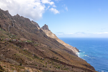 Panoramic view of Atlantic Ocean coastline and Anaga mountain range on Tenerife, Canary Islands, Spain, Europe, EU. Looking at Cabezo el Tablero crag. Scenic coastal hiking trail from Afur to Taganana