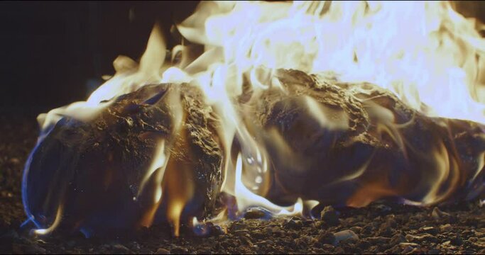 Burning man lies on the floor