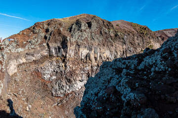 Panoramic view on the edge of the active volcano crater of Mount Vesuvius, Province of Naples, Campania region, Southern Italy, Europe, EU. Volcanic landscape full of stones, ashes and solidified lava