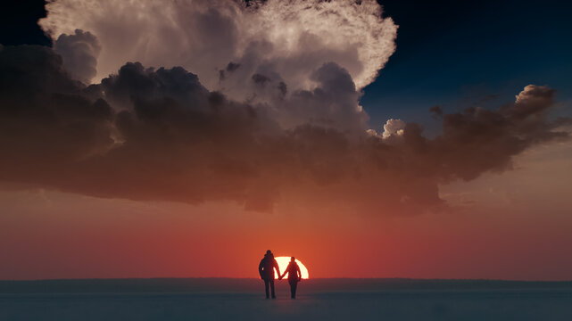 The two travelers walking through the arctic snowy field on sunset background © Artem
