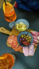Typical italian aperitif (aperitivo) served with snacks at bar in Catania, Sicily, Italy, Europe....