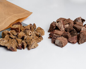 Natural dried treats for dogs. Treats for rewarding and training dogs. Dried meat products for dogs. Animal care.Selective focus. Advertisement for dog treats.