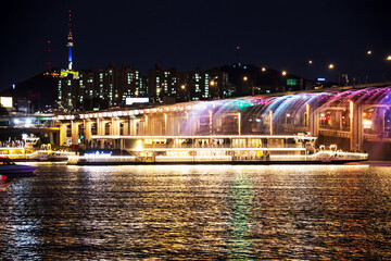 SEOUL, KOREA - SEP 06, 2019: The cruise on Han river and Rainbow fountain show at Banpo Bridge at...