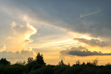 Dramatic sky with clouds at summer sunset