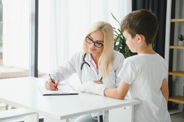 A child with a plaster on his hand at clinic