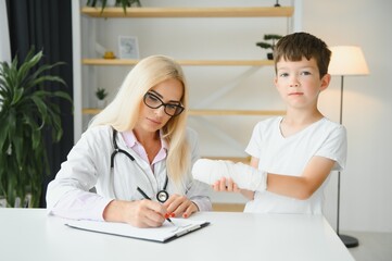 A child with a plaster on his hand at clinic