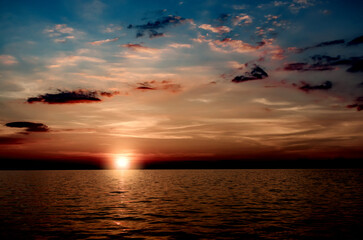 Fantastic sunset over ocean. Beautiful sea sunset with dramatic sky.