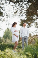 Fototapeta premium Portrait of lovely future parents during sunset