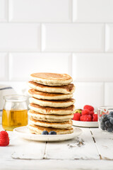 stack of pancakes with berries