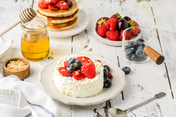 cottage cheese with raspberries, strawberries and blueberries