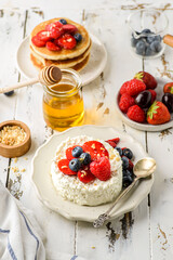 cottage cheese with raspberries, strawberries and blueberries