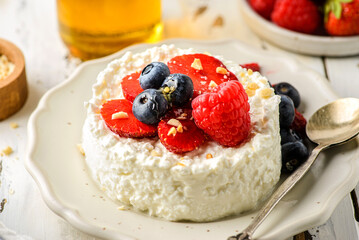 cottage cheese with raspberries, strawberries and blueberries