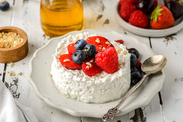 cottage cheese with raspberries, strawberries and blueberries