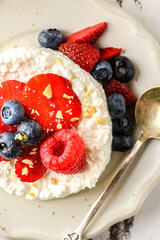 cottage cheese with raspberries, strawberries and blueberries